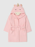 A pink waffle-knit hooded robe with a unicorn-themed hood featuring a gold horn, pink ears, and a cream-colored snout, shown against a light gray background.